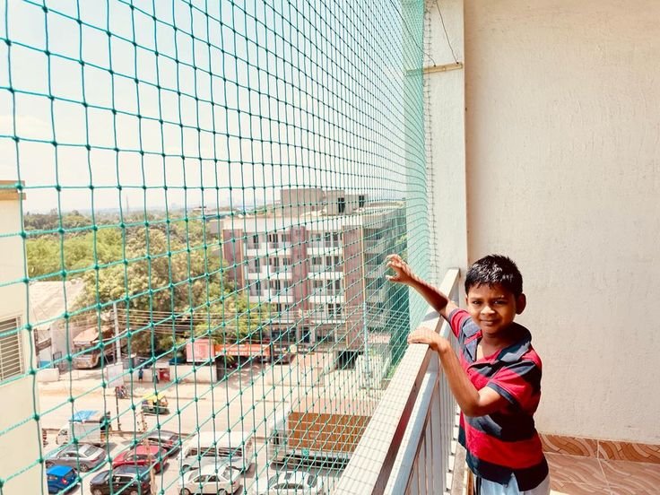 Child safety nets installed across balcony openings